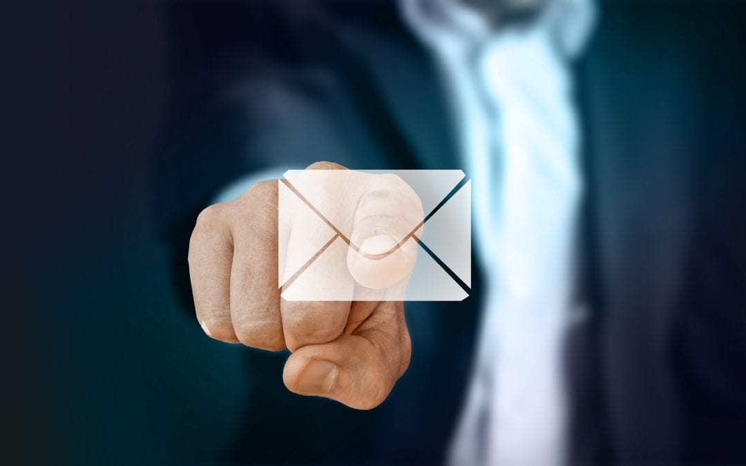 business man pressing email button